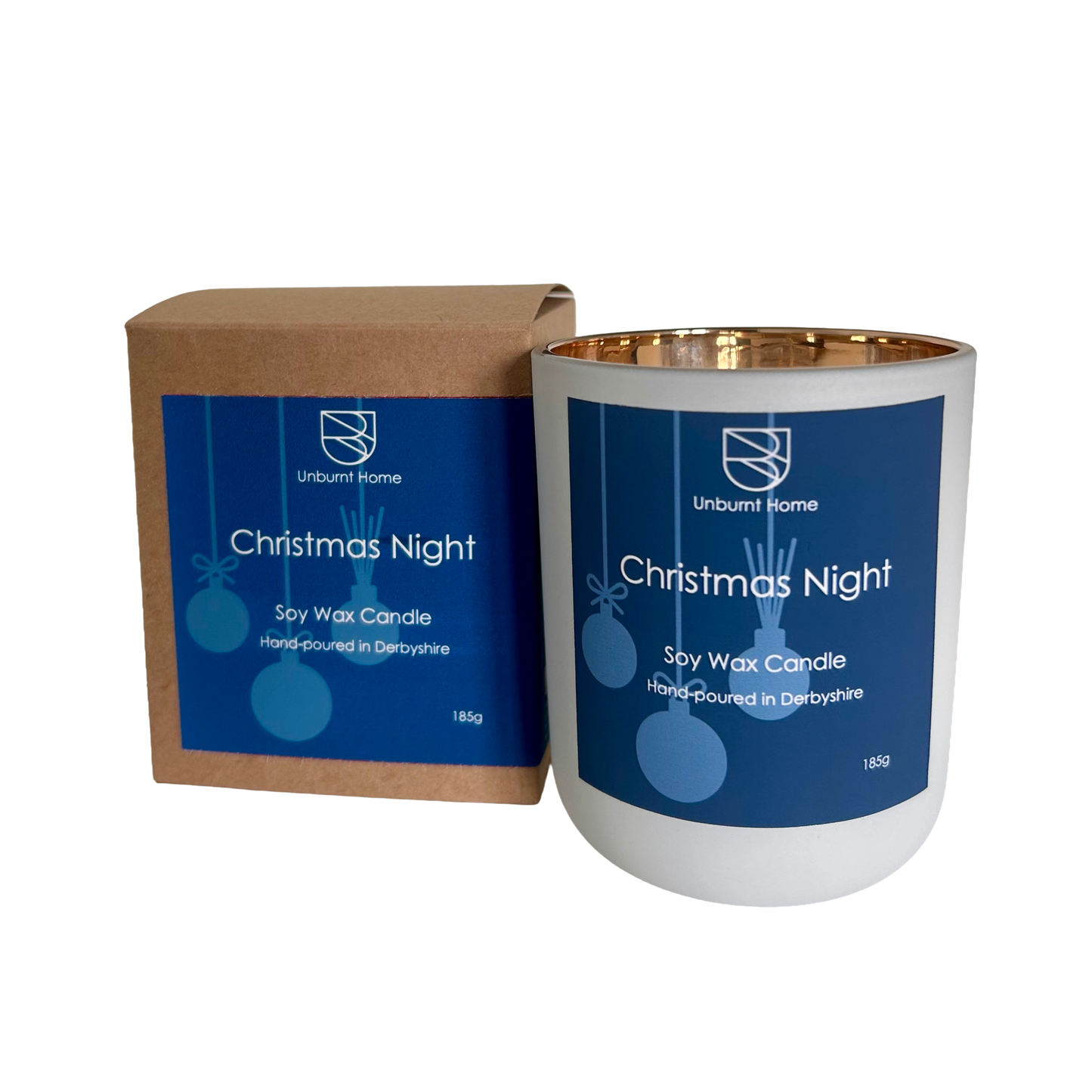 Christmas Night Christmas Candle in white jar with blue label and gold interior also with craft box on a white background