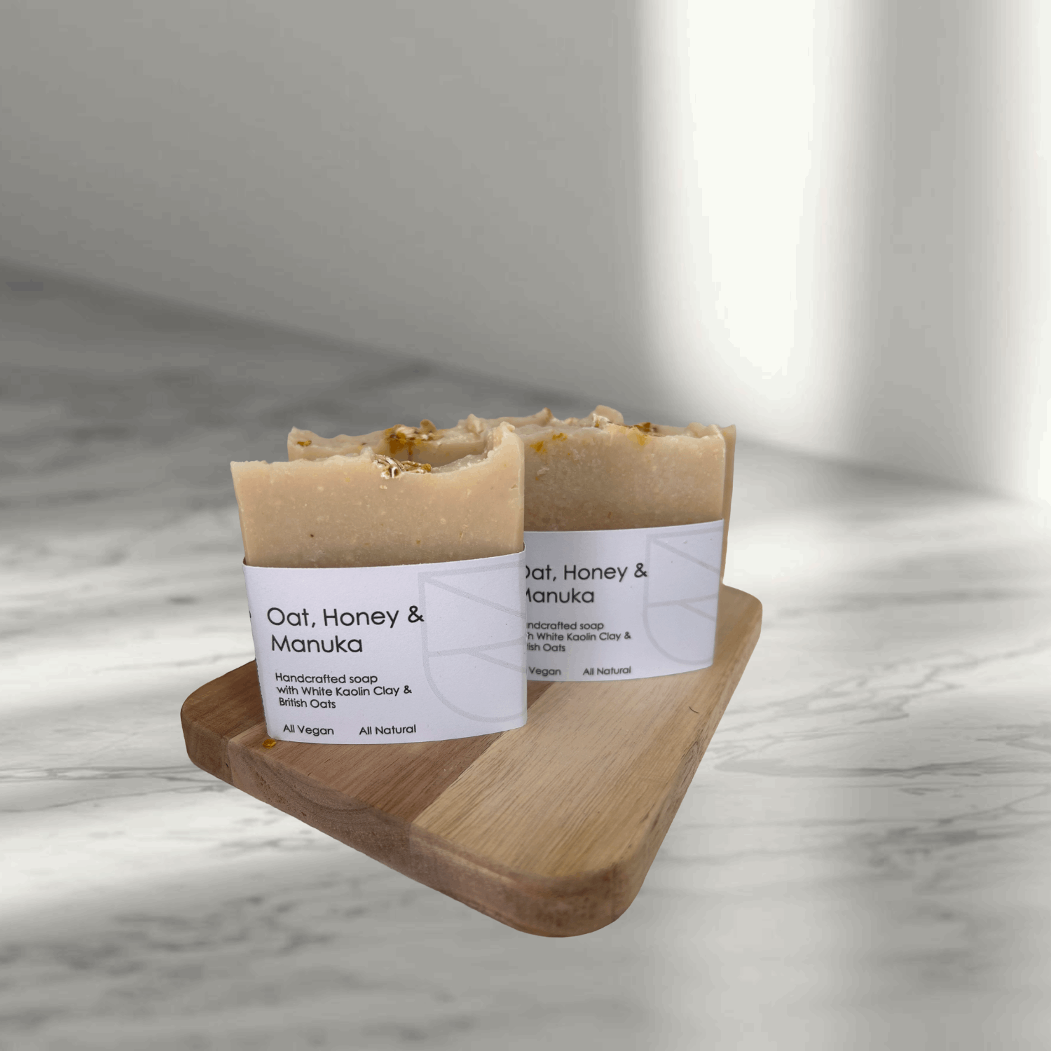 Oat Honey and Manuka Soap on a board on a bathroom counter top