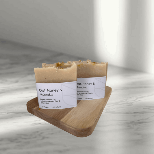 Oat Honey and Manuka Soap on a board on a bathroom counter top