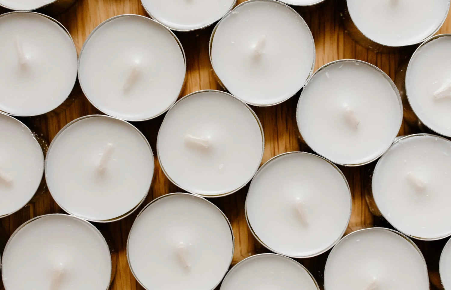wax melt Tea Lights on wooden surface