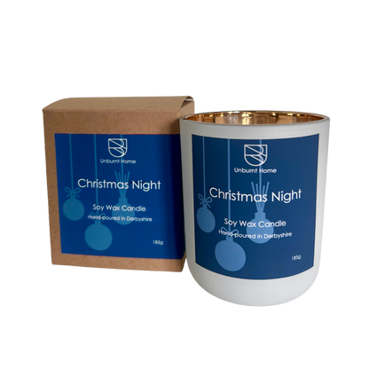 Christmas Night Christmas Candle in white jar with blue label and gold interior also with craft box on a white background