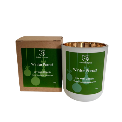 Winter forest Christmas candle with packaging on white background